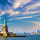 Statue of Liberty on Liberty Island with Manhattan skyline in background, New York Harbor